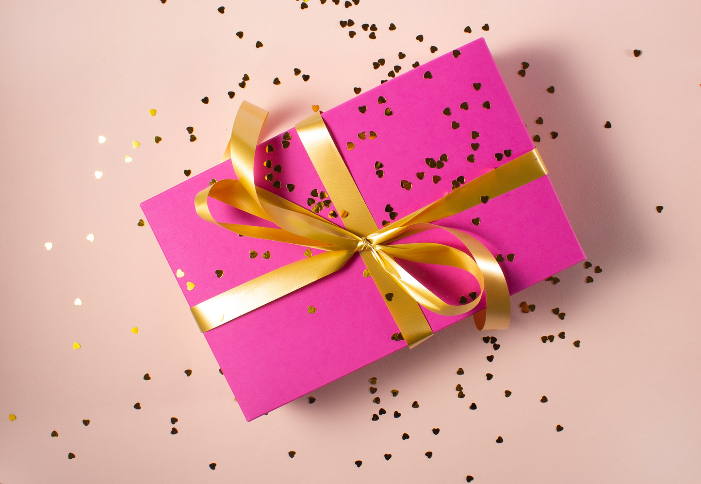 Pink gift box with ribbon
