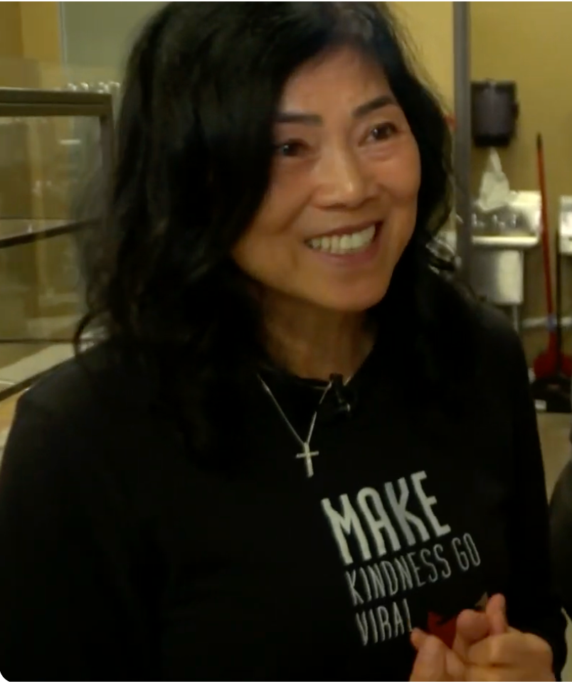 Woman in Bekinder Coffee shirt